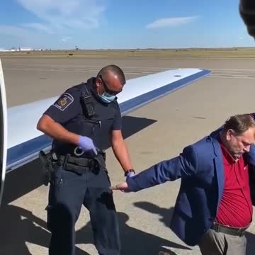 Pastor Artur Pawlowski gets arrested at the Calgary International Airport