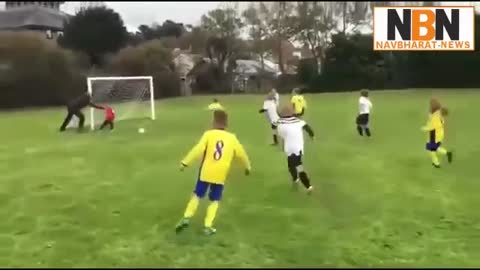 Father pushes son to save a goal