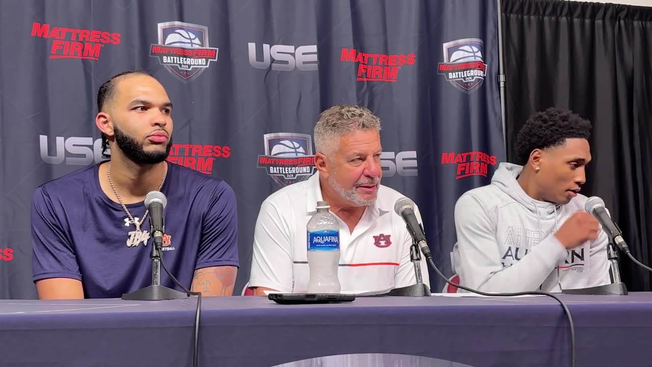 Auburn head coach Bruce Pearl, Johni Broome and Tahaad Pettiford following 74-69 win over Houston