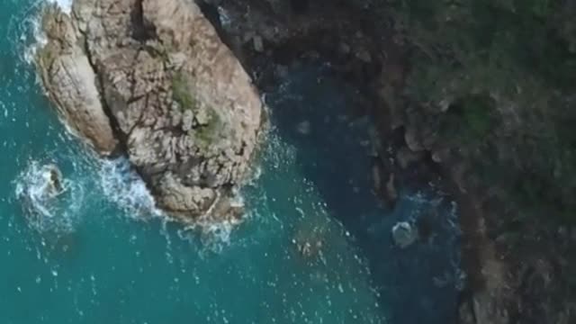 Rocky peninsula during a sunny day seen from above