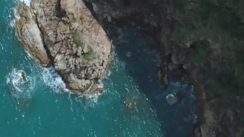 Rocky peninsula during a sunny day seen from above