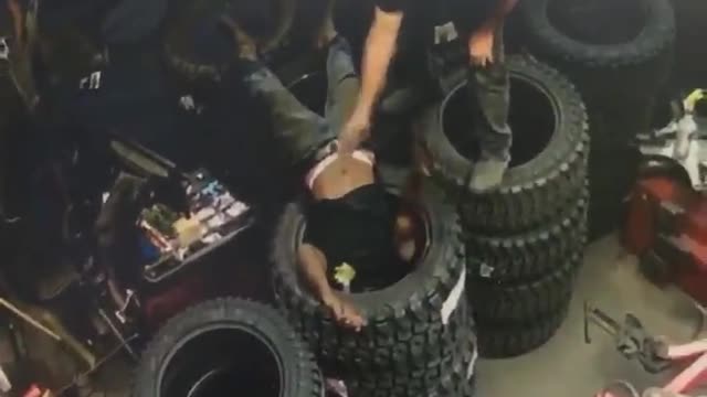 Man Accidentally Gets Head Stuck in Tire Stack