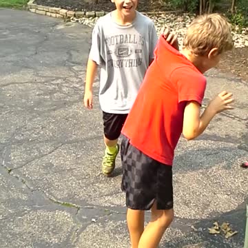 Boy Tries To Race With Shirt Attached To Gate