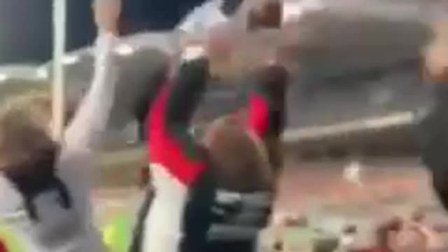 woman protects herself with a child shield