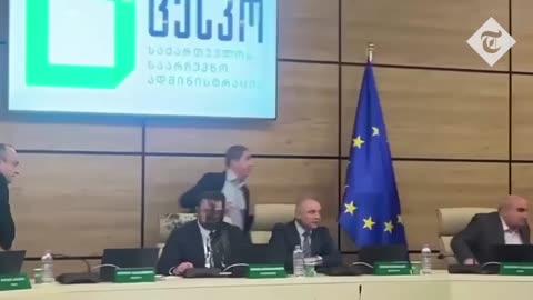 Shocking moment Georgian politician throws paint over election chief