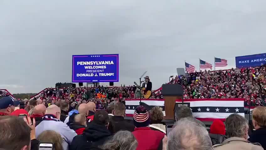 Crowd sing the Star Spangled Banner