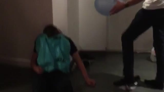 Guy pop balloon drunk friend