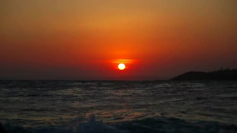 Sunset time lapse and surfers