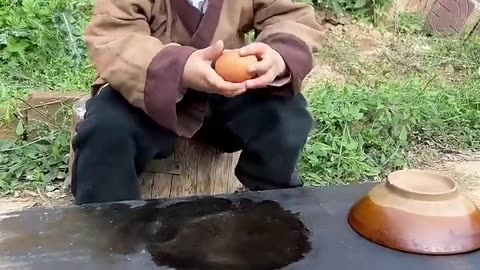 Beautiful nature life a village boy making egg