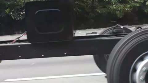 Bus Chassis Driving down Highway