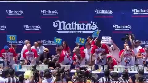 Protester Gets SLAMMED At Hot Dog Eating Contest