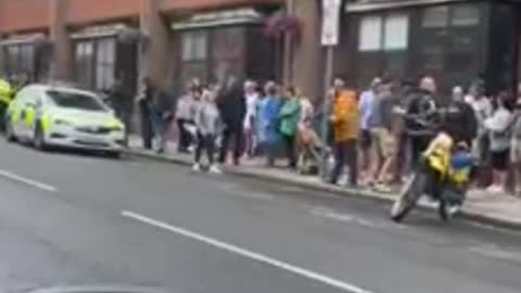 UK police protecting a drag queen story hour 'child groomer' during a protest by parents.