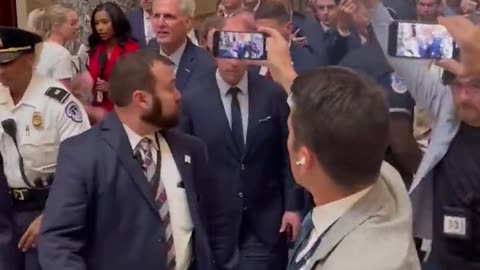 Kevin McCarthy being escorted out of the Speaker office.