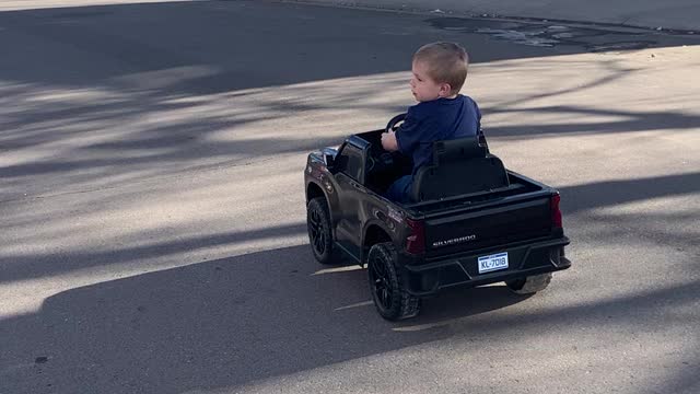 Baby Leo driving Chevy Silverado