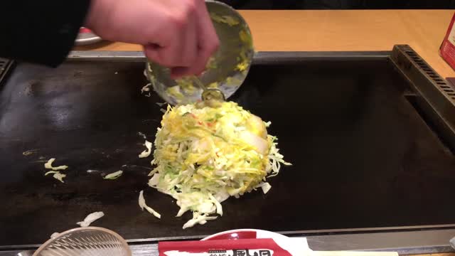 Making Okonomiyaki by a local Japanese employee