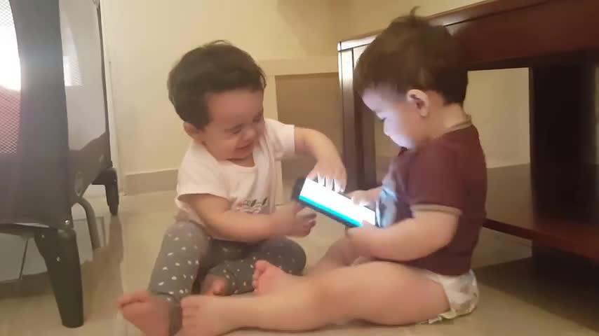 Funny baby fighting twins fight over phone