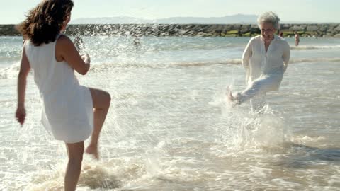 A Mother and Daughter Playing at the Beach