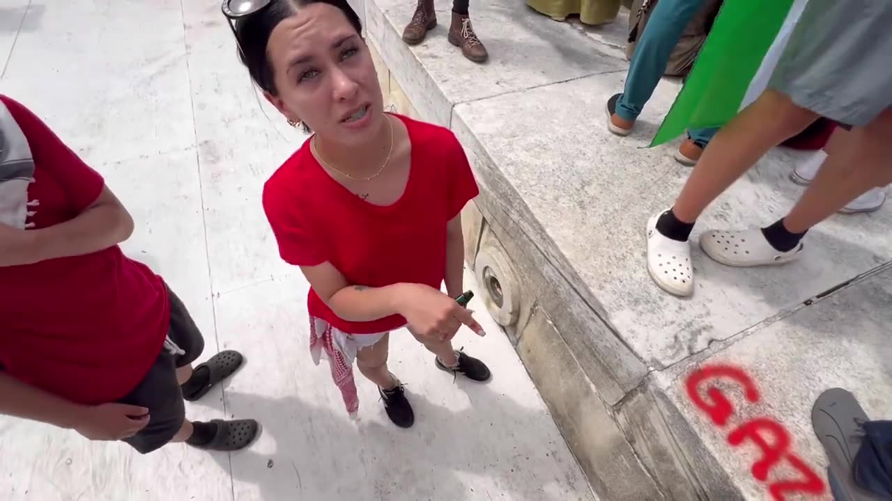 Who is this woman vandalizing the monument? ARREST HER!