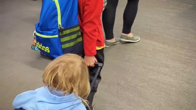 Brother Helps Sis at Airport