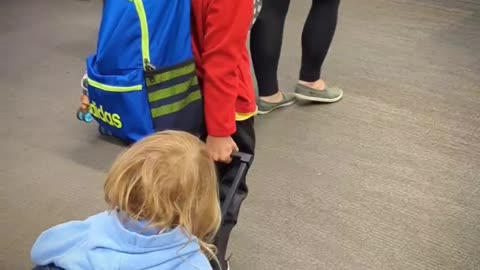 Brother Helps Sis at Airport