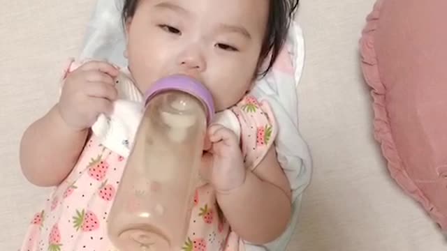 cute baby drinking milk