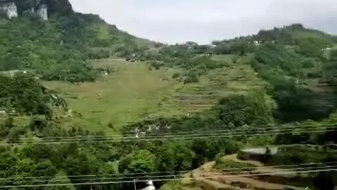 The countryside and fields surrounded by mountains