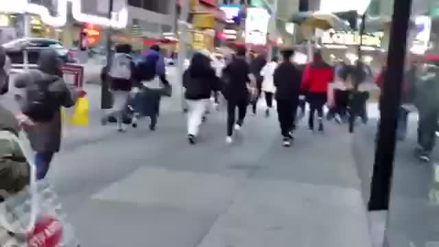 MANHOLE EXPLOSION CAUSES PANIC IN NEW YORKS TIME SQUARE - ANGLE 2