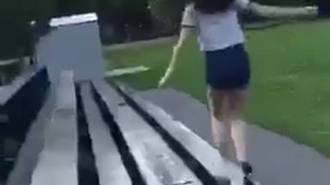 Blue shorts girl bleacher run faceplant