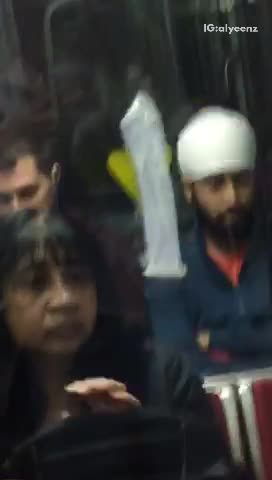 Condom stuck on window of red subway