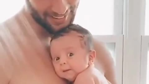 a father bathing his child