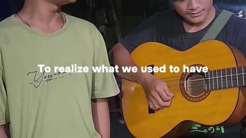 Street singer in Indonesia Cover of Bruno Mars' song It Will Rain