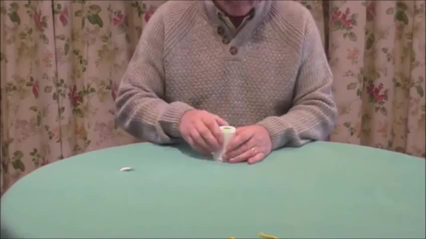 A Paper Cup Passes Through A Second Paper Cup.