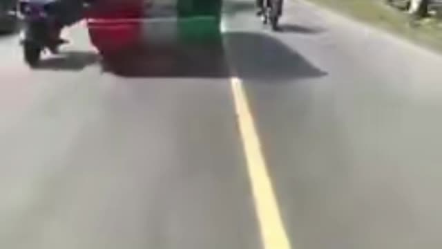 Car nudges motorbike driver crazy