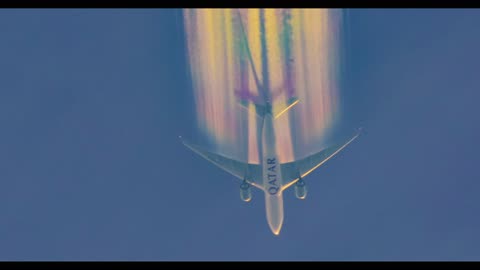 Airplane Leaves Amazing Rainbow Contrails Overhead