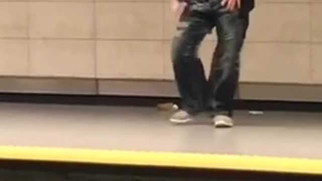 Yes buff headband man dances in subway terminal