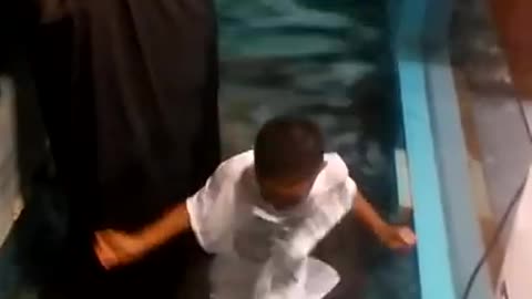 Kid decided to baptize himself after long wait