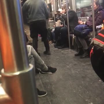Short hair girl headphones denim jacket dancing in subway