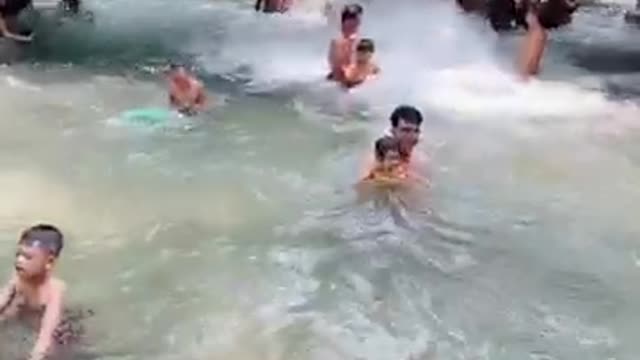 Bathing in Binh Chau stream