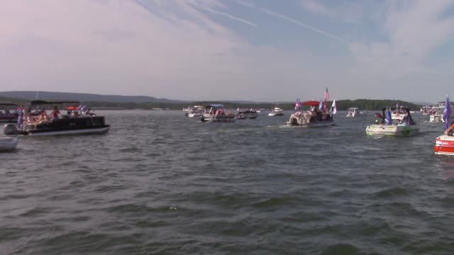 0404 Arkansas Trump Boat Parade Lake Ouachita. Drone and standing in the boat