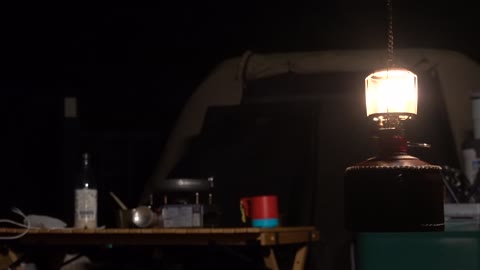 Light a lantern at night at a camping site. 3