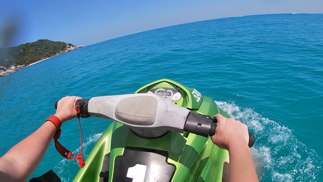 girl cutting waves on a hydro scooter