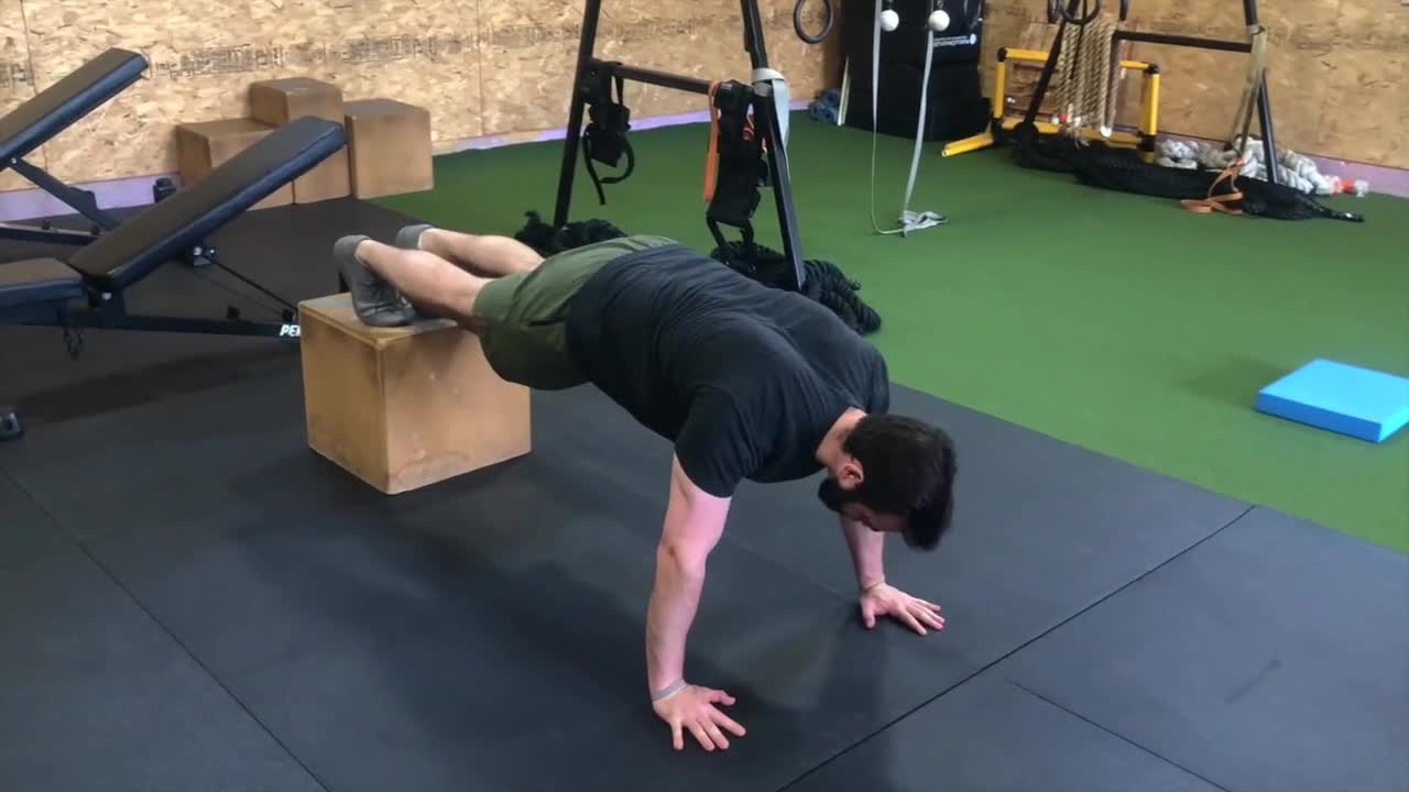 Feet Elevated Serratus Push Up with title