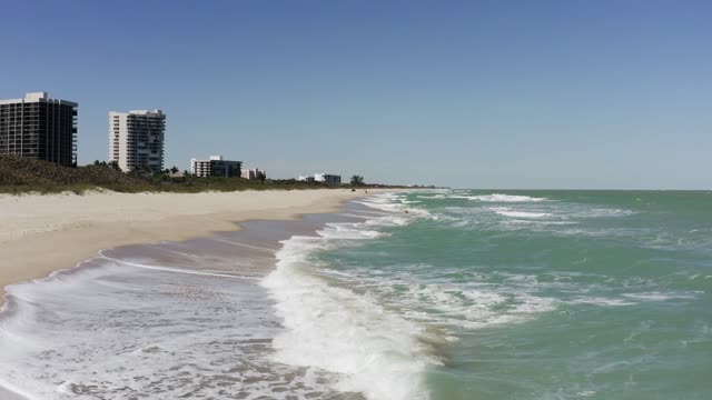 Waves hugging the Beach