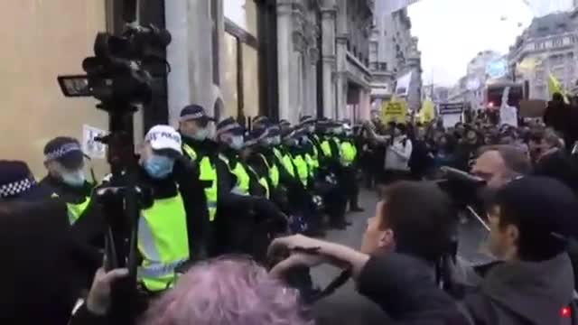 Apple store in London under attack as Protester's scream, Shame on You, & throw eggs