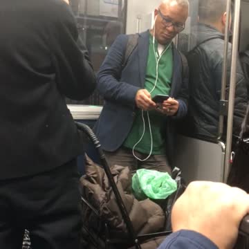 Woman subway black beanie eating bag of herbs vegetables lettuce