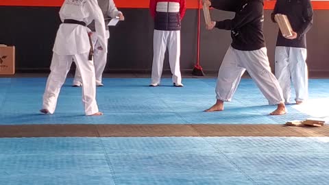 Black belt breaking 1" boards