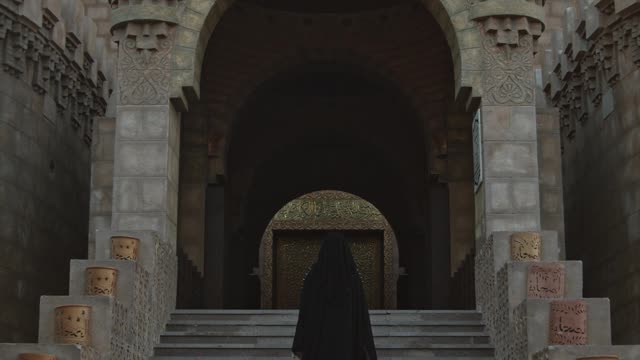 a-person-climbing-the-mosque-stairs