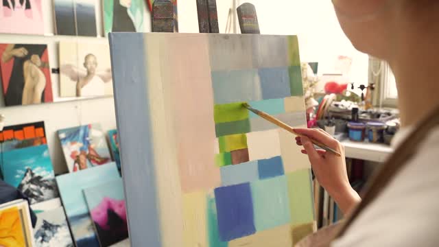 A Person Doing Abstract Painting on a Canvas