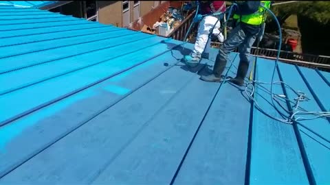 Spray on application of our Butyl Liquid Rubber over existing metal roof