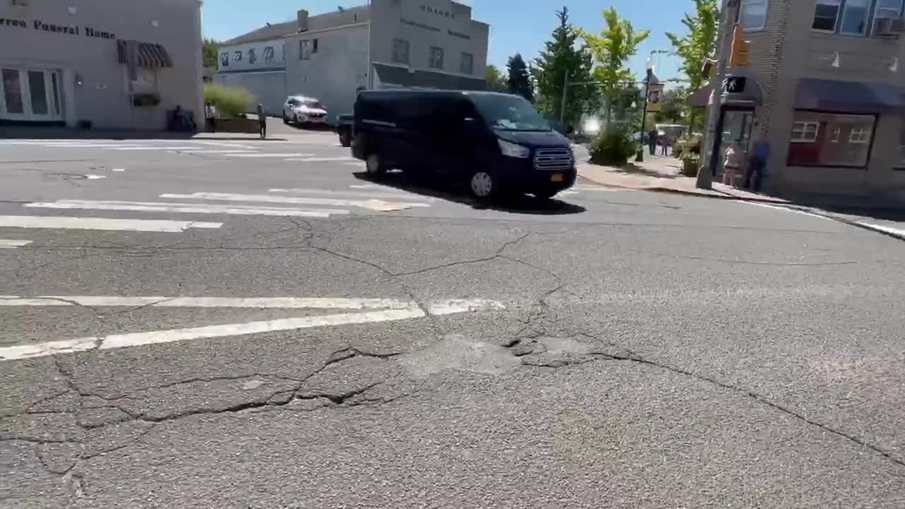 A man in New Jersey man has some choice words as Biden's motorcade passes by